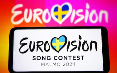 KYIV, UKRAINE - 2024/01/24: In this photo illustration, Eurovision Song Contest 2024 (ESC) logo is seen on a smartphone and a pc screen. The Eurovision Song Contest 2024 is scheduled to take place in May 2024 in Malmo Sweden. (Photo Illustration by Pavlo Gonchar/SOPA Images/LightRocket via Getty Images)
