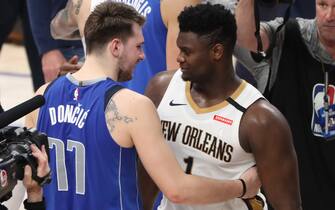 DALLAS, TX - MARCH 4: Luka Doncic #77 of the Dallas Mavericks hugs Zion Williamson #1 of the New Orleans Pelicans after the game on March 4, 2020 at the American Airlines Center in Dallas, Texas. NOTE TO USER: User expressly acknowledges and agrees that, by downloading and or using this photograph, User is consenting to the terms and conditions of the Getty Images License Agreement. Mandatory Copyright Notice: Copyright 2020 NBAE (Photo by Joe Murphy/NBAE via Getty Images)