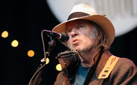 Neil Young performs during Neil Young's 24th Annual Bridge Benefit at Shoreline Amphitheatre on October 24, 2010 in Mountain View, California. (Photo by Tim Mosenfelder/Getty Images)