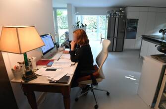 Simona Pozzi, Co-Head of Retail Hub of Equita Company, Italy,at work in her living room, Milan, Italy,19 October 2020. Due to the coronavirus epidemic and to contain the risk of contagion, many companies have still forced their employees not to show up for work and, for those authorized, to resort to smartworking. ANSA / DANIEL DAL ZENNARO