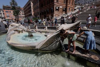 People during a hot day, in Rome, Italy, 17 July 2023. ANSA/GIUSEPPE LAMI