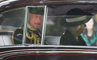 epa09937801 Britain's Prince Charles travels by car with his wife Camilla, Duchess of Cornwall, to parliament ahead of the State Opening of Parliament in London, Britain, 10 May 2022. Charles is representing the Queen who will be absent for the first time in over fifty years. Buckingham Palace announced that for the first time since 1963 Queen Elizabeth II would not be delivering the Queen s Speech. The UK government are set to introduce 38 new laws including the controversial Public Order Act.  EPA/ANDY RAIN