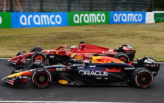 SUZUKA, JAPAN - APRIL 05: Max Verstappen, Red Bull Racing RB20, alongside Charles Leclerc, Ferrari SF-24 during the Japanese GP at Suzuka on Friday April 05, 2024 in Suzuka, Japan. (Photo by Mark Sutton / Sutton Images)