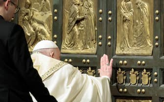Pope Francis opens the Holy Door to mark the opening of the 2025 Catholic Holy Year, or Jubilee, in St. Peter's Basilica, at the Vatican, December 24, 2024. REUTERS/Remo Casilli/Pool