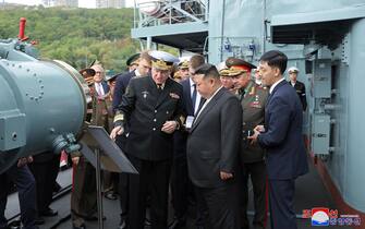 epa10865648 A photo released by the official North Korean Central News Agency (KCNA) shows North Korean leader Kim Jong Un (C) listening to a presentation with Commander-in-Chief of the Russian Navy Nikolai Yevmenov (C-L) while accompanied by Minister of Defense of Russia Sergei Shoigu (2-R) while aboard a warship during a visit to Vladivostok, Russia, 16 September 2023 (issued 17 September 2023).  EPA/KCNA   EDITORIAL USE ONLY