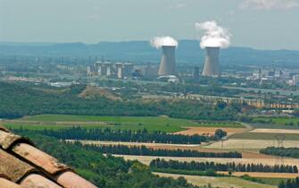 view from the village la Garde Adhemar Adhémar to the valley of the river Rhone with the nuclear power station Tricastin