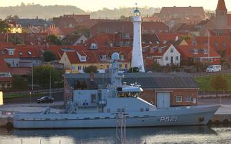 epa10214900 A Royal Danish Navy Diana-class large ocean patrol vessel HDMS Freja is pictured at the harbor of Ronne at the island Bornholm, Denmark, 30 September 2022. The Swedish Coast Guard announced on 29 September that it discovered a fourth gas leak on the Nord Stream pipelines damaged earlier this week in the Baltic Sea.  EPA/HANNIBAL HANSCHKE