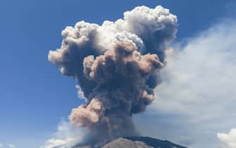 Smoke rises from the crater of the Etna volcano as it erupts, on Mount Etna near Catania on June 2, 2025. (Photo by Giuseppe Distefano / AFP)