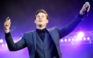 LONDON, UNITED KINGDOM - SEPTEMBER 07: Lee Ryan of Blue perform on stage as part of the BBC Proms in the Park series at Hyde Park on September 7, 2013 in London, England. (Photo by Gus Stewart/WireImage)
