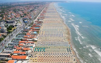 Aerial view of Lido di Camaiore - Viareggio seacoast - beach during the fly with helicopter HH412C, Volpe 220, of the Aerial Section of the Italian Finance guard (Guardia di Finanza) as patrol areas and seacoast over Tuscany region against illegal activity and crowd of people during the country's emergency period aimed at contains the spread of the Covid-19 coronavirus, Lido di Camaiore, Italy, 15 August 2020. ANSA/FABIO MUZZI