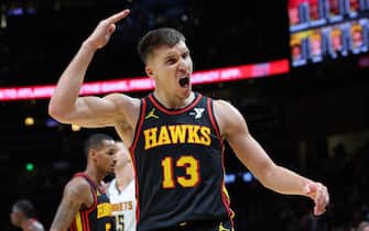ATLANTA, GEORGIA - DECEMBER 11:  Bogdan Bogdanovic #13 of the Atlanta Hawks reacts after a turnover by the Denver Nuggets during the fourth quarter at State Farm Arena on December 11, 2023 in Atlanta, Georgia.  NOTE TO USER: User expressly acknowledges and agrees that, by downloading and/or using this photograph, user is consenting to the terms and conditions of the Getty Images License Agreement.  (Photo by Kevin C. Cox/Getty Images)