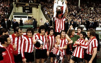 File photo dated 05-05-1973 of Sunderland's captain Bobby Kerr held aloft by his teammates Billy Hughes and goalkeeper Jim Montgomery after their FA Cup Final victory against Leeds United at Wembley Stadium.