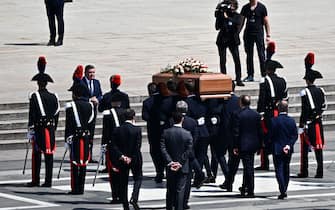 Pallbearers carry the coffin of Italy's former prime minister and media mogul Silvio Berlusconi in the Duomo cathedral in Milan on June 14, 2023 for the state funeral of Berlusconi. (Photo by GABRIEL BOUYS / AFP) (Photo by GABRIEL BOUYS/AFP via Getty Images)