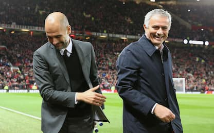 Manchester United manager Jose Mourinho (left) embraecs Manchester City manager Pep Guardiola before the EFL Cup, round of 16 match at Old Trafford, Manchester.