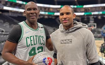 MILWAUKEE, WI - MAY 9: Al Horford #42 of the Boston Celtics poses for a photo with the NBA 75 diamond ball and his father, Tito Horford after Game 4 of the Eastern Conference Semifinals against the Milwaukee Bucks on May 9, 2022 at the Fiserv Forum Center in Milwaukee, Wisconsin. NOTE TO USER: User expressly acknowledges and agrees that, by downloading and or using this Photograph, user is consenting to the terms and conditions of the Getty Images License Agreement. Mandatory Copyright Notice: Copyright 2022 NBAE (Photo by Jenny Fischer/NBAE via Getty Images).