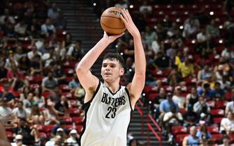 LAS VEGAS, NEVADA - JULY 13: Donovan Clingan #23 of the Portland Trail Blazers takes a shot against the San Antonio Spurs in the first half of a 2024 NBA Summer League game at the Thomas & Mack Center on July 13, 2024 in Las Vegas, Nevada. The Spurs defeated the Trail Blazers 83-77. NOTE TO USER: User expressly acknowledges and agrees that, by downloading and or using this photograph, User is consenting to the terms and conditions of the Getty Images License Agreement. (Photo by Candice Ward/Getty Images)