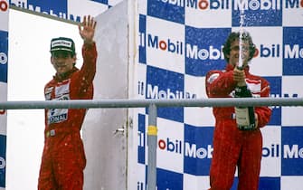 HOCKENHEIMRING, GERMANY - JULY 30: Alain Prost sprays champagne, as Ayrton Senna leaves the podium during the German GP at Hockenheimring on July 30, 1989 in Hockenheimring, Germany. (Photo by LAT Images)