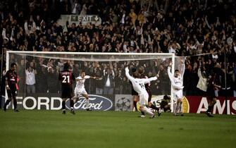 AC Milan players look on as Leeds United's Lee Bowyer (second r) celebrates his goal and their keeper Dida lies in the net after dropping the ball