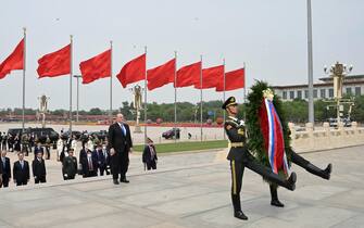 epa10649379 Russian Prime Minister Mikhail Mishustin takes part in a wreath-laying ceremony at the Monument to the People's Heroes in Tiananmen Square, in Beijing, China, 24 May 2023. The Russian and Chinese governments are coordinating the implementation of the agreements reached during the Chinese president's visit to Moscow in March, Russian Prime Minister Mikhail Mishustin said.  EPA/ALEXANDER ASTAFYEV / SPUTNIK / GOVERNMENT PRESS SERVICE / POOL MANDATORY CREDIT