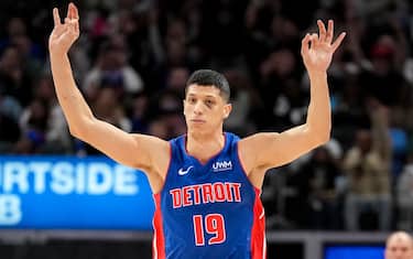 DETROIT, MICHIGAN - MARCH 09: Simone Fontecchio #19 of the Detroit Pistons reacts after making a 3-point basket against the Dallas Mavericks during the first quarter at Little Caesars Arena on March 09, 2024 in Detroit, Michigan. NOTE TO USER: User expressly acknowledges and agrees that, by downloading and or using this photograph, User is consenting to the terms and conditions of the Getty Images License Agreement. (Photo by Nic Antaya/Getty Images)