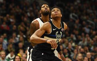 MILWAUKEE, WISCONSIN - DECEMBER 06:  Giannis Antetokounmpo #34 of the Milwaukee Bucks works against Paul George #13 of the Los Angeles Clippers during the second half of a game at Fiserv Forum on December 06, 2019 in Milwaukee, Wisconsin. NOTE TO USER: User expressly acknowledges and agrees that, by downloading and or using this photograph, User is consenting to the terms and conditions of the Getty Images License Agreement.  (Photo by Stacy Revere/Getty Images)