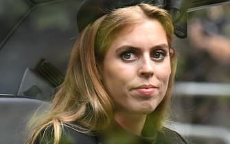 LONDON, ENGLAND - SEPTEMBER 19: Princess Beatrice of York follows the coffin of Queen Elizabeth II, draped in the Royal Standard, as it travels on the State Gun Carriage of the Royal Navy, from Westminster Abbey to Wellington Arch September 19, 2022 in London, England. Elizabeth Alexandra Mary Windsor was born in Bruton Street, Mayfair, London on 21 April 1926. She married Prince Philip in 1947 and ascended the throne of the United Kingdom and Commonwealth on 6 February 1952 after the death of her Father, King George VI. Queen Elizabeth II died at Balmoral Castle in Scotland on September 8, 2022, and is succeeded by her eldest son, King Charles III.  (Photo by Paul Ellis - WPA Pool/Getty Images)