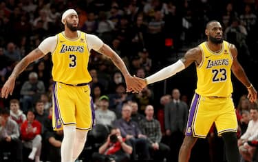 PORTLAND, OREGON - NOVEMBER 17: Anthony Davis #3 and LeBron James #23 of the Los Angeles Lakers react after a basket against the Portland Trail Blazers during the fourth quarter at Moda Center on November 17, 2023 in Portland, Oregon. NOTE TO USER: User expressly acknowledges and agrees that, by downloading and or using this photograph, User is consenting to the terms and conditions of the Getty Images License Agreement. (Photo by Steph Chambers/Getty Images)