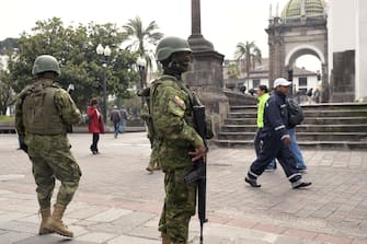 Soldiers are deployed in downtown Quito on January 9, 2024, a day after Ecuadorean President Daniel Noboa declared a state of emergency following the escape from prison of a dangerous narco boss. At least four police officers were kidnapped in Ecuador following a declaration of a 60-day state of emergency on January 8 after dangerous gang leader Adolfo Macias, also known as "Fito," escaped from maximum security detention. (Photo by Rodrigo BUENDIA / AFP)