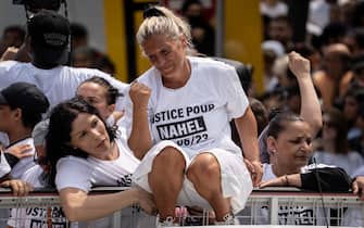 NANTERRE, FRANCE - JUNE 29: Mounia, mother of the French teenager killed by police, attends a memorial march for her son Nahel  on June 29, 2023 in Nanterre, France. A French teenager of North African origin was shot dead by police on June 27th, the third fatal traffic stop shooting this year in France - causing nationwide unrest and clashes with police forces. On June 28th, the victim's family called for a memorial march starting at Nanterre's main police station on June 29th. (Photo by Abdulmonam Eassa/Getty Images)