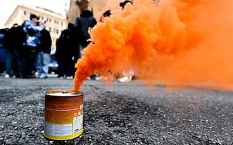 A smoke-bomb during a rally held next to Prefecture of Genoa to contest ministers Matteo Piantedosi and Matteo Salvini after Pisa clashes in Genoa, Italy, 4 March 2024. ANSA/SIMONE ARVEDA