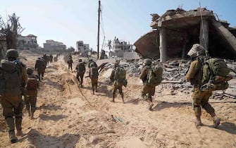 This picture released by the Israeli army on November 5, 2023, shows Israel troops patrolling inside the Gaza Strip as battles between Israel and the Palestinian Hamas movement continue. (Photo by Israeli Army / AFP) / RESTRICTED TO EDITORIAL USE - MANDATORY CREDIT "AFP PHOTO / ISRAELI ARMY  " - NO MARKETING NO ADVERTISING CAMPAIGNS - DISTRIBUTED AS A SERVICE TO CLIENTS