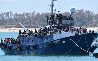 The fishing boat carrying about 600 migrants rescued in recent days 100 miles off the coast of Sicily towed by a tugboat arrived in the port of Catania, Italy, 12 April 2023. The vessel was escorted by the 'Nave Peluso' of the Coast Guard. The migrants on board greeted their arrival with applause and whistles and shouts of 'Bella Italia'.
ANSA/ ORIETTA SCARDINO