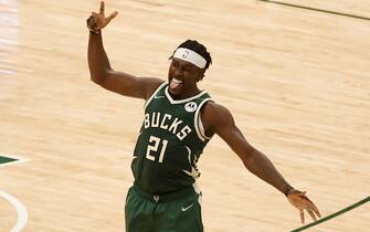 MILWAUKEE, WI - JUNE 23: Jrue Holiday #21 of the Milwaukee Bucks celebrates during the game against the Atlanta Hawks during Game 1 of the Eastern Conference Finals of the 2021 NBA Playoffs on June 23, 2021 at the Fiserv Forum Center in Milwaukee, Wisconsin. NOTE TO USER: User expressly acknowledges and agrees that, by downloading and or using this Photograph, user is consenting to the terms and conditions of the Getty Images License Agreement. Mandatory Copyright Notice: Copyright 2021 NBAE (Photo by Kamil Krzaczynski/NBAE via Getty Images). 