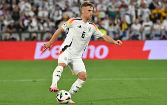 Germany's defender #06 Joshua Kimmich controls the ball during the UEFA Euro 2024 Group A football match between Germany and Scotland at the Munich Football Arena in Munich on June 14, 2024. (Photo by Miguel MEDINA / AFP)