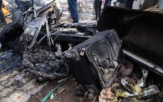epa12171334 Debris at the site of a plane crash near Sardar Vallabhbhai Patel International Airport in Ahmedabad, Gujarat, western India, 12 June 2025. Air India flight AI171, bound for London carrying 242 passengers and crew members on board a Boeing 787-8 aircraft, crashed minutes after take-off in the Meghaninagar area of Ahmedabad.  EPA/SIDDHARAJ SOLANKI