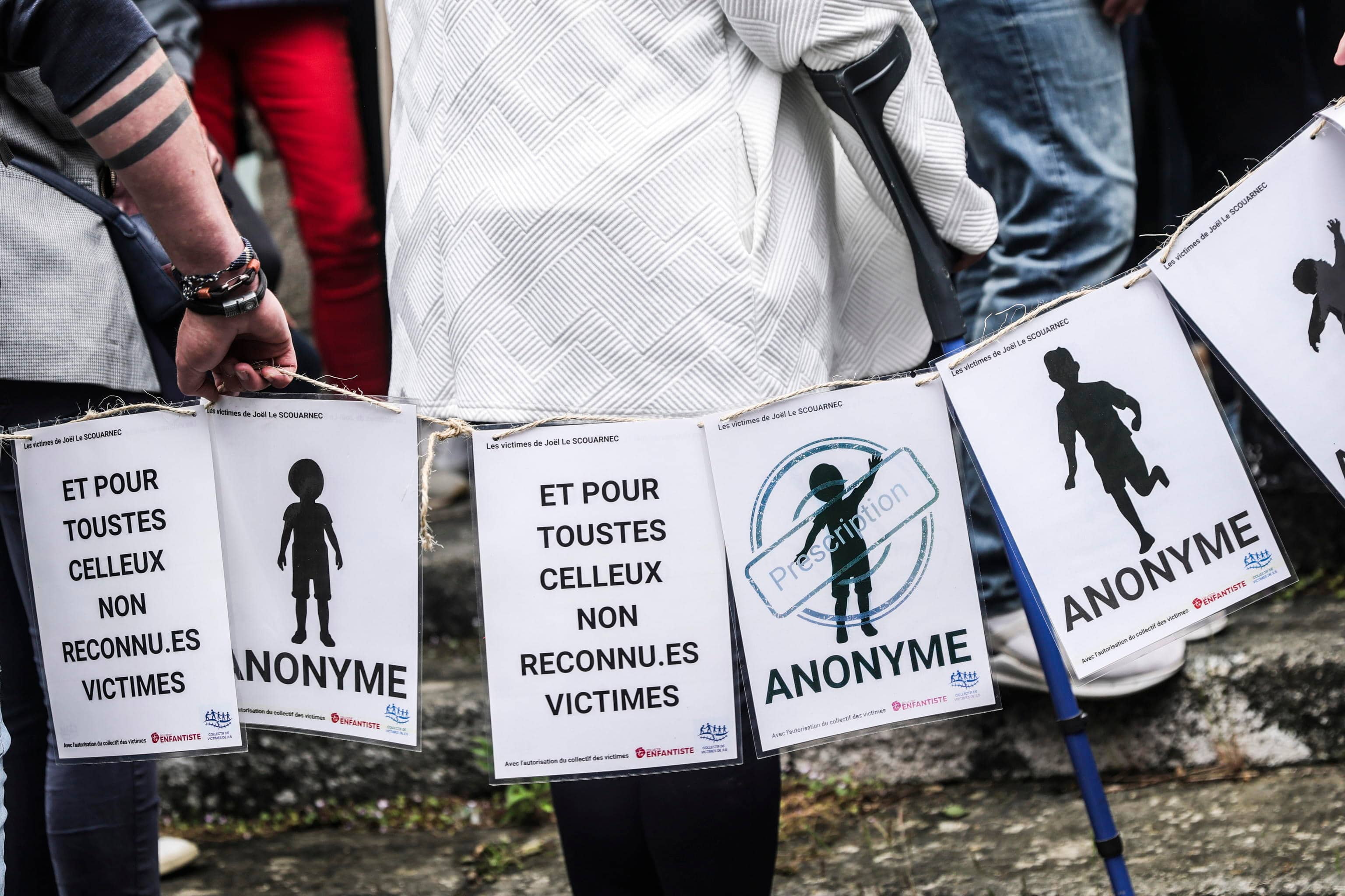 FRANCE TRIALS epa12140685 People, including victims, carry banners representing the victims of Joel Le Scouarnec on the verdict day of the trial of the French surgeon in Vannes, France, 28 May 2025. A French court on 28 May handed retired surgeon Joel Le Scouarnec a 20-year sentence for the rape and aggravated sexual assault of 299 victims, most of them minors, crimes committed between 1986 and 2014. EPA/TERESA SUAREZ