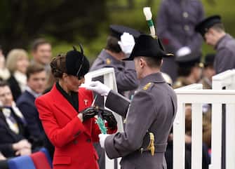 The Princess of Wales is presented with a leek corsage during a visit to the 1st Battalion Welsh Guards at Combermere Barracks in Windsor, Berkshire. Picture date: Wednesday March 1, 2023.