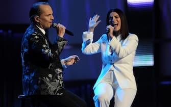 Miguel Bose and Laura Pausini  perform on stage during the 14th annual Latin Grammy Awards, November 21, 2013 at the Mandalay Bay Resort and Casino in Las Vegas, Nevada.  AFP PHOTO / Robyn Beck        (Photo credit should read ROBYN BECK/AFP via Getty Images)