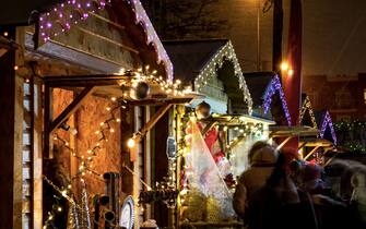 Local artists selling their products in Christmas market on a cold day of winter at Atwater Market, Montreal, Canada