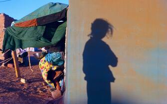 Shadow of a girl reflected in the haima at sunrise in the Sahrawi refugee camps in Algeria