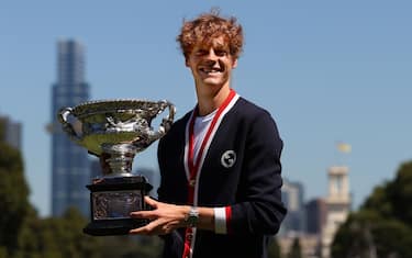 MELBOURNE, AUSTRALIA - JANUARY 29: Jannik Sinner of Italy poses with the Norman Brookes Challenge Cup after winning the 2024 Australian Open Final, at Royal Botanic Gardens on January 29, 2024 in Melbourne, Australia. (Photo by Kelly Defina/Getty Images)