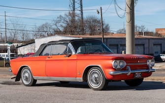 Vintage antique 1963 red Chevrolet Corvair 900 Monza Spyder convertible, a rear engine air cooled car or automobile parked in Montgomery Alabama, USA.