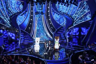 SANREMO, ITALY - FEBRUARY 07: The mascots of the Milan-Cortina 2026 Winter Olympics and Paralympics, Federico Barra and Amadeus attend the 74th Sanremo Music Festival 2024 at Teatro Ariston on February 07, 2024 in Sanremo, Italy. (Photo by Daniele Venturelli/Daniele Venturelli/Getty Images )