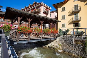 The typical wood bridge with flowers simbol of the town of Ponte di Legno, Brescia province, Italy.