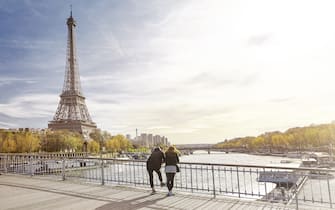 Tourist couple looking at The Eiffel Tower, Paris, France