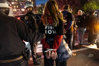 NEW YORK, NEW YORK - APRIL 23: Police detain protesters during a demonstration of the war in Gaza on April 23,Â 2024Â in the Brooklyn borough of New York City. The event, which resulted in dozens of arrests, was held blocks from the residence of U.S. Sen. Chuck Schumer (D-NY). Schumer is a longtime supporter ofÂ IsraelÂ but has recently criticized President Benjamin Netanyahu forÂ Israel'sÂ conduct in the war. (Photo by Andrew Lichtenstein/Corbis via Getty Images)