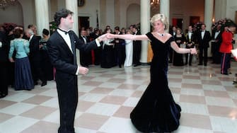 In this photo provided by the Ronald Reagan Presidential Library, Princess Diana dances with John Travolta in the Cross Hall of the White House in Washington, DC at a Dinner for Prince Charles and Princess Diana of the United Kingdom on November 9, 1985. Mandatory Credit: Pete Souza - Courtesy Ronald Reagan Library via CNP - NO WIRE SERVICE- Photo: Pete Souza/Consolidated News Photos/Pete Souza - Courtesy Ronald Reagan Library via CNP