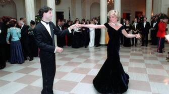 In this photo provided by the Ronald Reagan Presidential Library, Princess Diana dances with John Travolta in the Cross Hall of the White House in Washington, DC at a Dinner for Prince Charles and Princess Diana of the United Kingdom on November 9, 1985. Mandatory Credit: Pete Souza - Courtesy Ronald Reagan Library via CNP - NO WIRE SERVICE- Photo: Pete Souza/Consolidated News Photos/Pete Souza - Courtesy Ronald Reagan Library via CNP