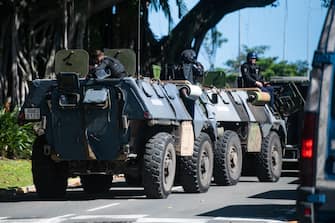 Gendarmerie armoured vehicles are seen near a police station in Noumea, France's Pacific territory of New Caledonia, on May 18, 2024. Hundreds of French security personnel tried to restore order in the Pacific island territory of New Caledonia on May 18, after a fifth night of riots, looting and unrest. (Photo by Delphine Mayeur / AFP) (Photo by DELPHINE MAYEUR/AFP via Getty Images)