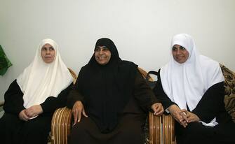 Newly-elected deputies of the Islamist movement Hamas (from L to R) Mariam Farhat, Jamila Al-Shanti, and Huda Naim meet to prepare for the first session of the new Palestinian Legislative Council (PLC) at the home of Hamas leader Ismail Haniyeh in the al-Shatti refugee camp in Gaza City, 17 February 2006. The Hamas-dominated parliament will be sworn in Saturday by Palestinian Authority president Mahmud Abbas. After the swearing in of the new parliament Abbas is to hand responsibility for forming a new government to a new prime minister chosen by Hamas.  AFP PHOTO/MAHMUD HAMS        (Photo credit should read MAHMUD HAMS/AFP via Getty Images)